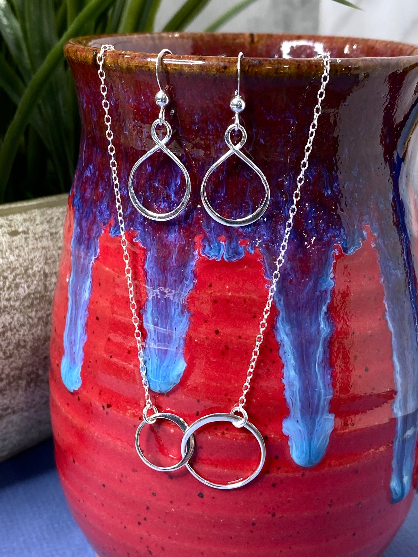 Two Intertwined Circle Sideways Necklace in Sterling Silver